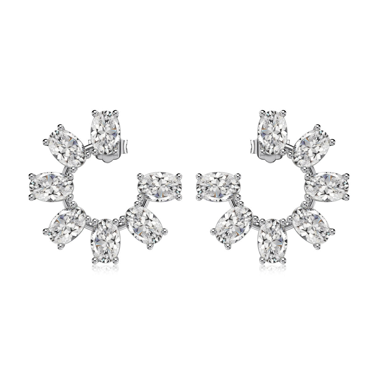 Pair of crescent-shaped diamond earrings on a white background