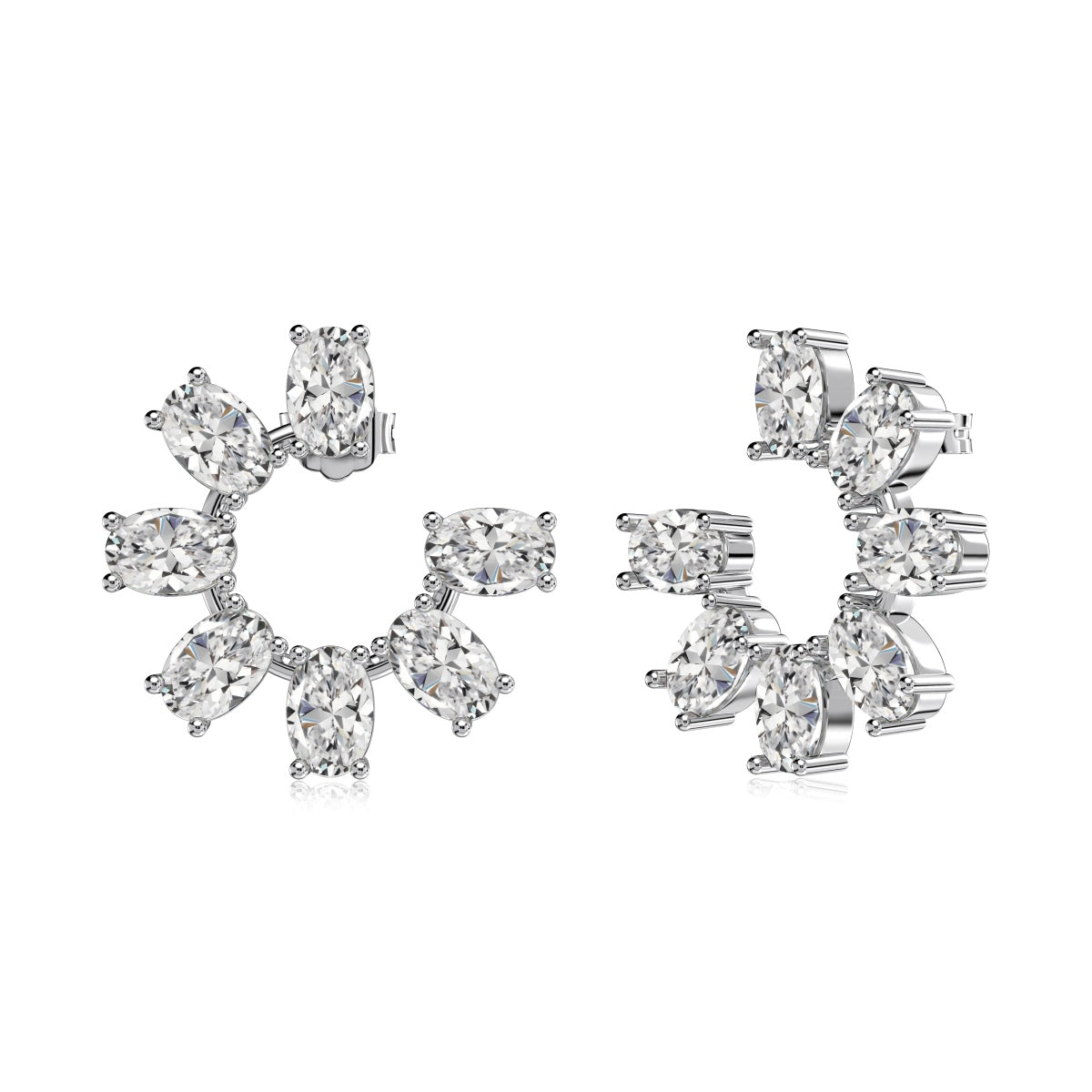 Side view of a pair of crescent shaped zircon earrings on a white background 