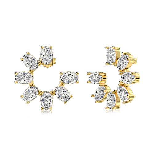 Gold earrings with clear gemstones on a white background