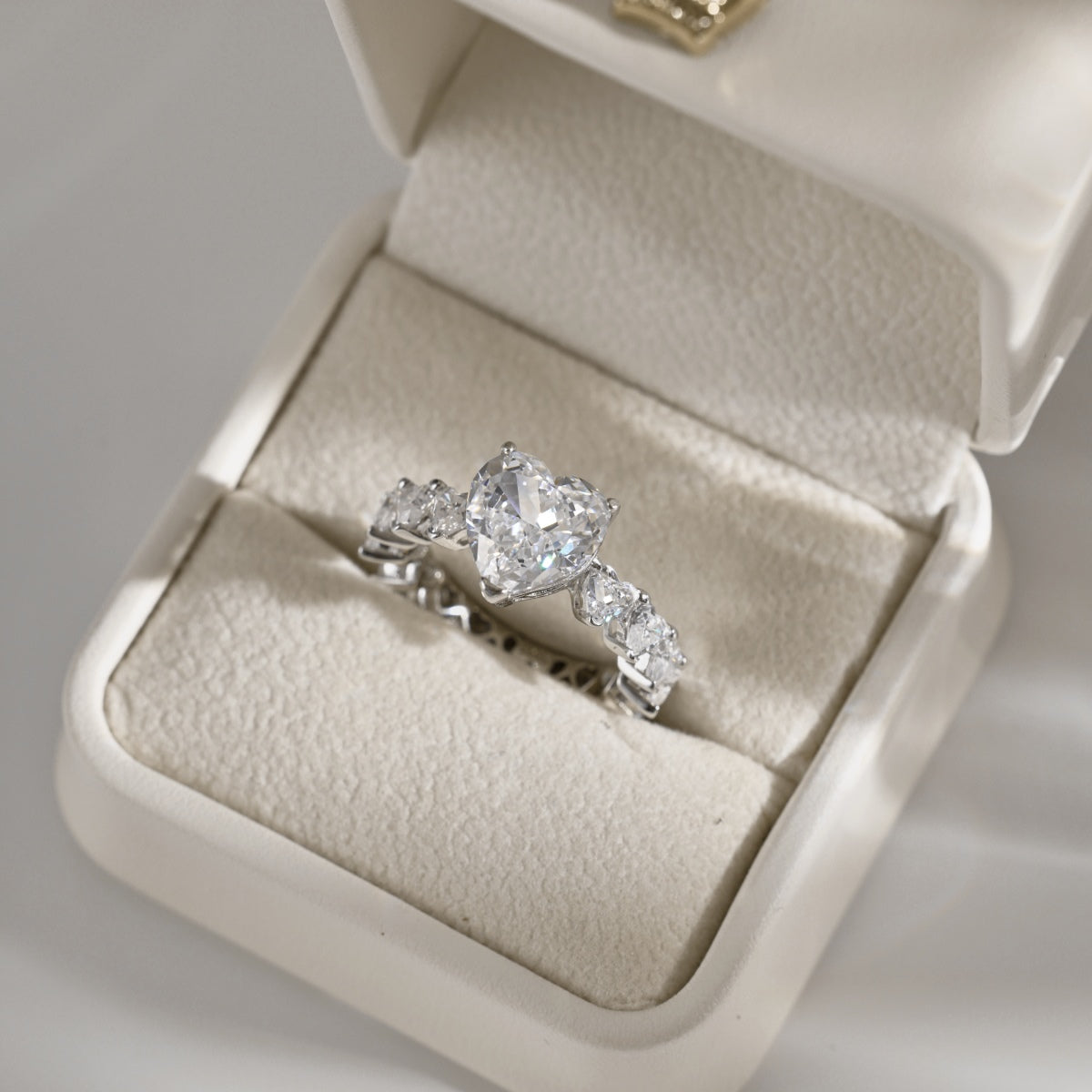 heart Diamond ring in a jewelry box on a light background
