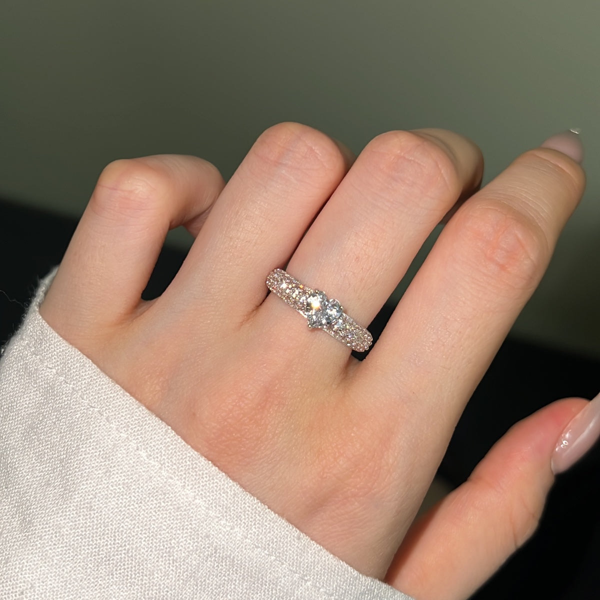 woman wearing silver heart gemstone ring with pave zircon chunky band