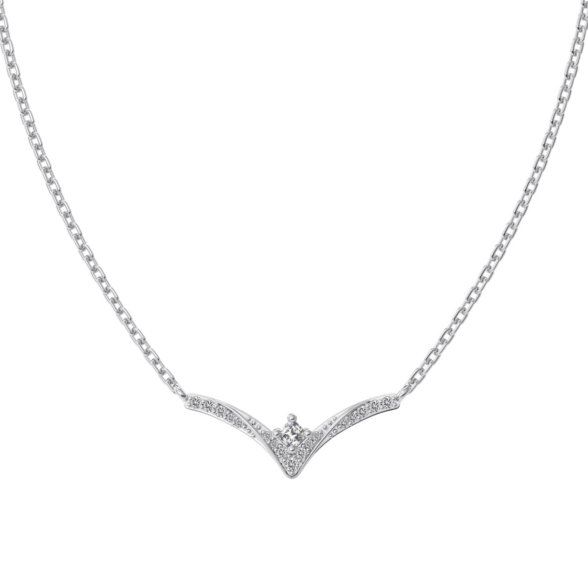 Silver chevron pendant necklace with a small diamond on a white background
