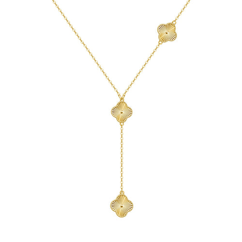 Gold necklace with four leaf clover drop pendants on a white background