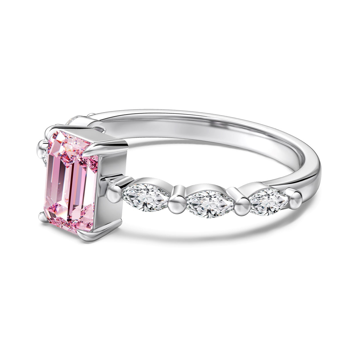 Silver ring with a pink gemstone and smaller diamonds on a white background