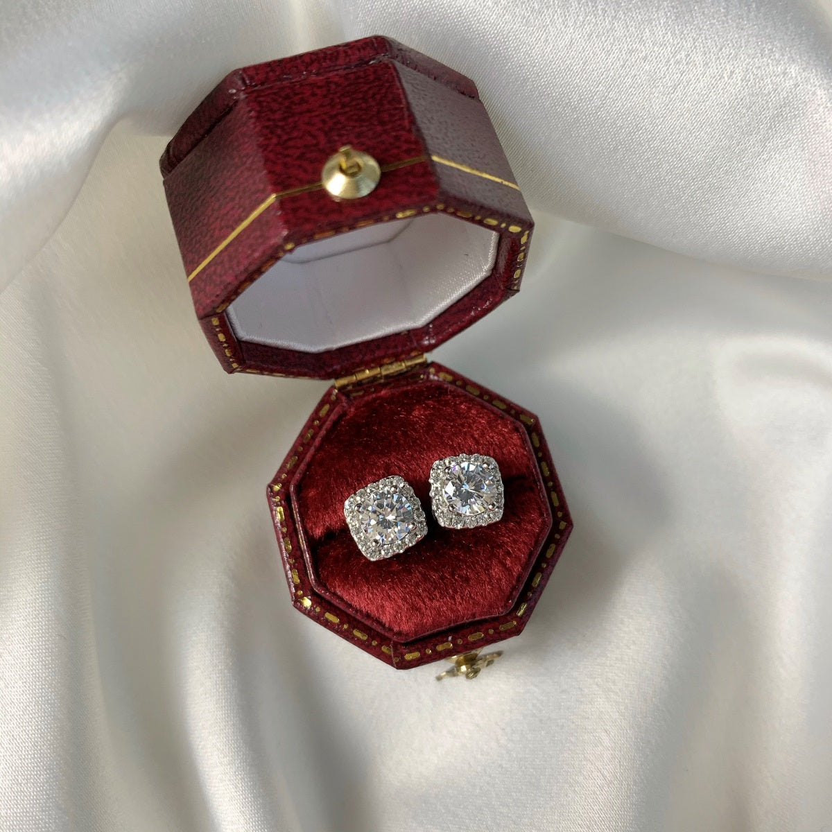 square diamond earrings in a red box