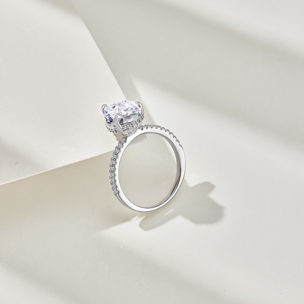 teardrop diamond ring on white background in a photoshoot
