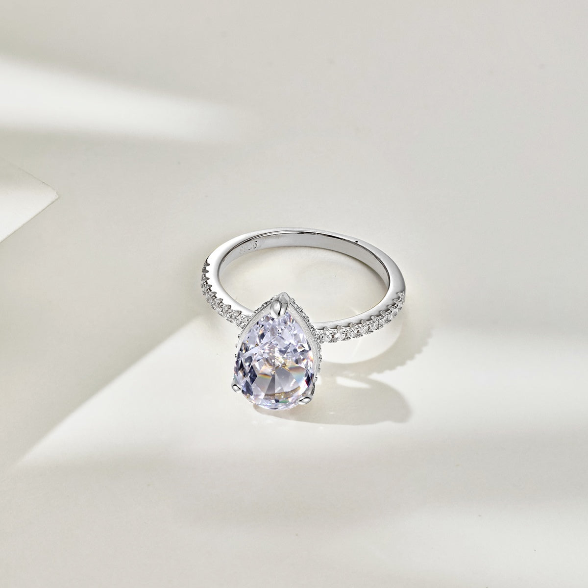 frontview photo of teardrop diamond ring in studio