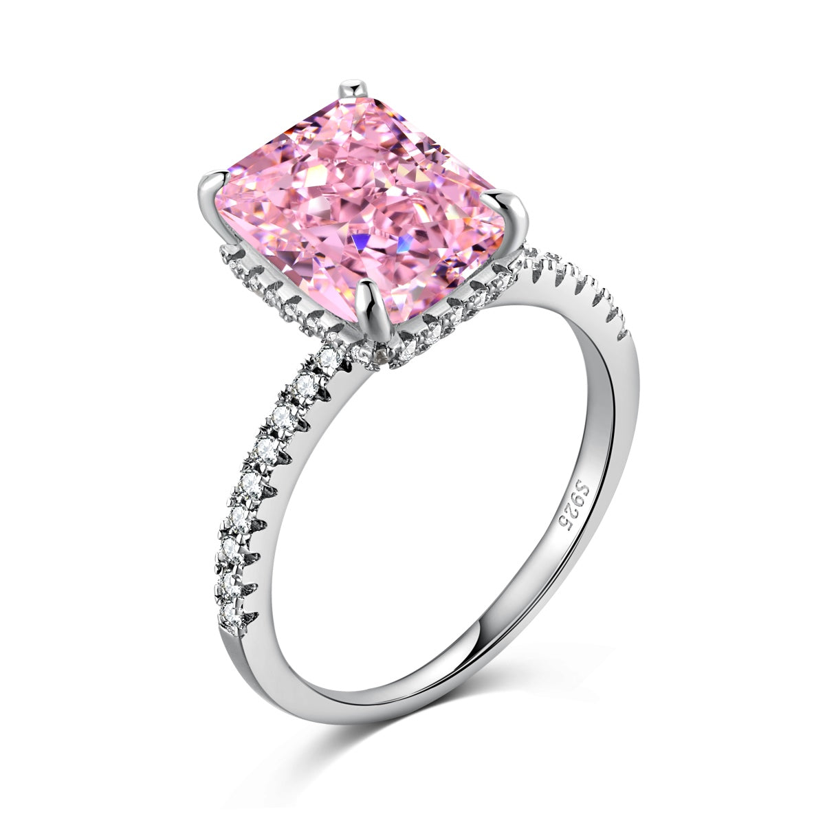 Ring with a pink gemstone and diamond-studded band on a white background