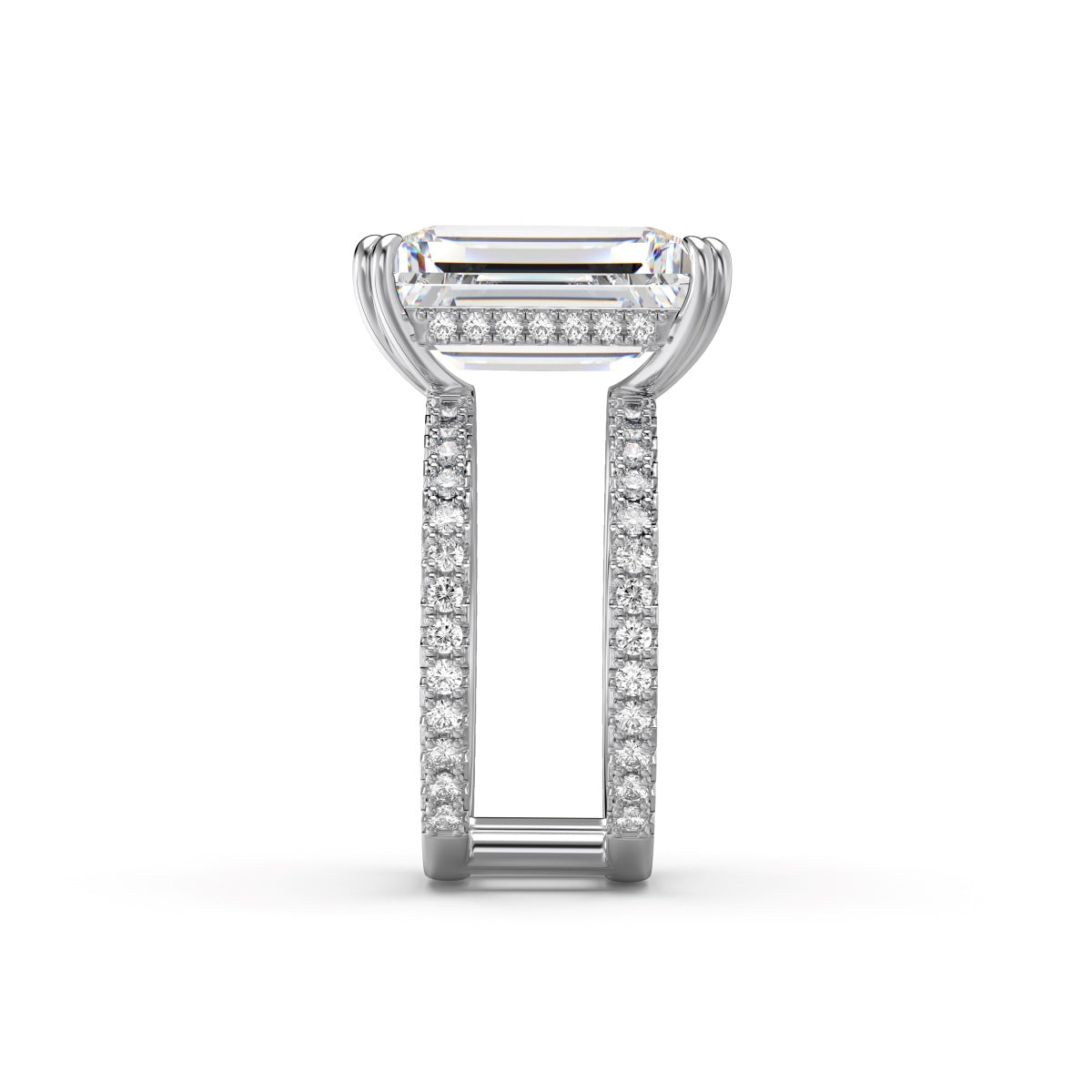 Diamond ring with a rectangular center stone on a white background